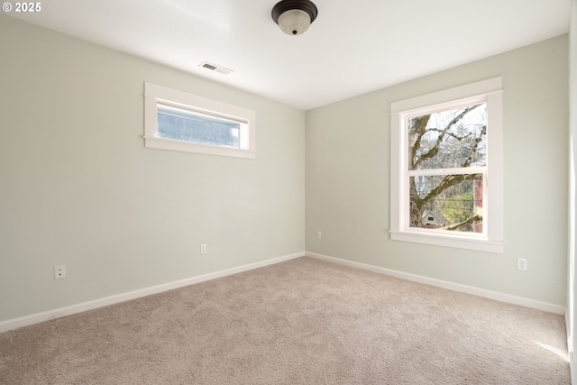 empty room featuring light carpet