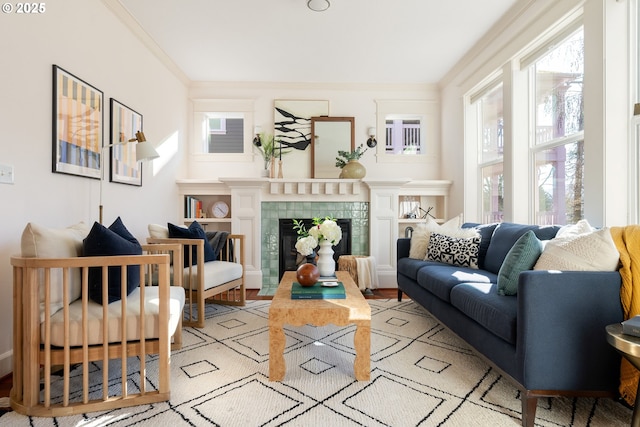 living area featuring a fireplace and ornamental molding