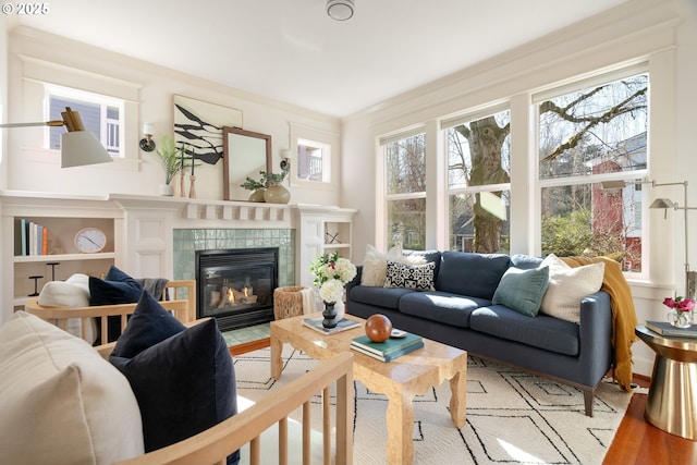 sunroom with a healthy amount of sunlight and a fireplace