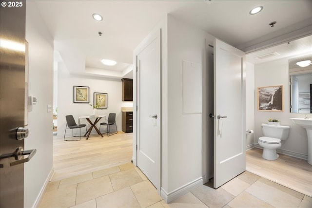 bathroom featuring toilet, recessed lighting, visible vents, baseboards, and tile patterned floors