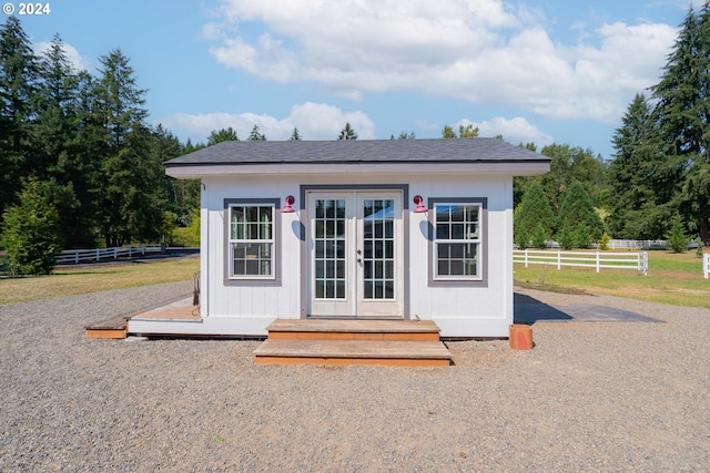 view of outbuilding with an outdoor structure and fence