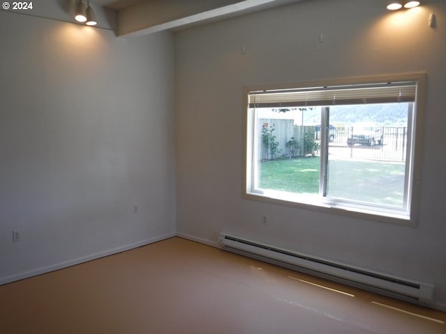 unfurnished room with baseboards and baseboard heating