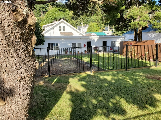 exterior space featuring a front yard and fence