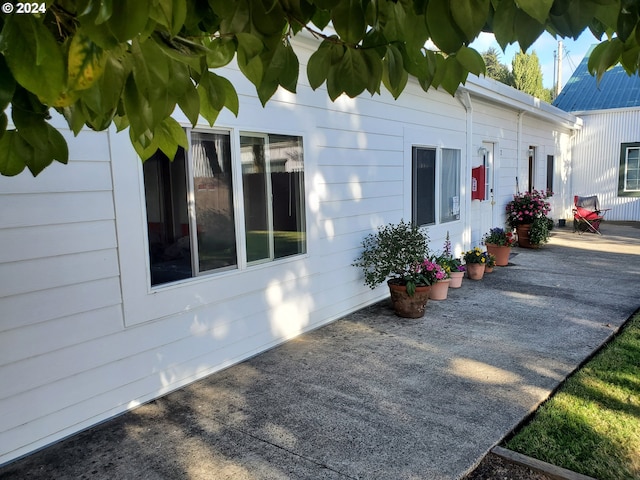 view of side of home featuring a patio area