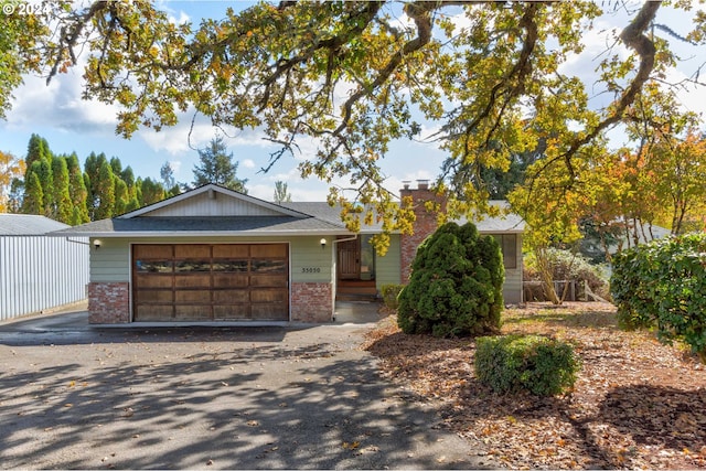 ranch-style house featuring a garage