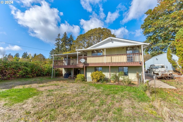 rear view of property with a deck