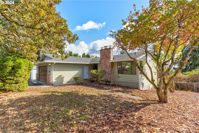 single story home with a garage