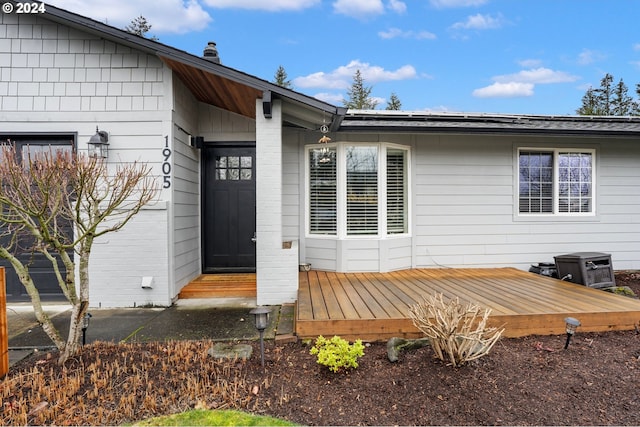 entrance to property featuring a deck