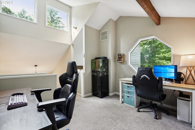 carpeted office with vaulted ceiling with beams