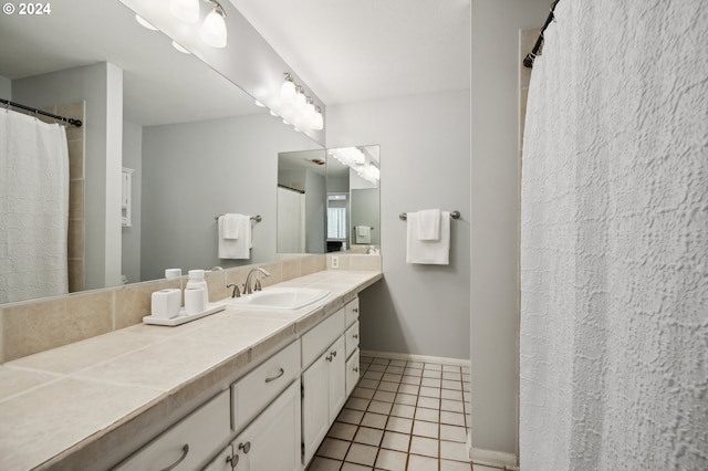 bathroom with vanity and tile patterned flooring