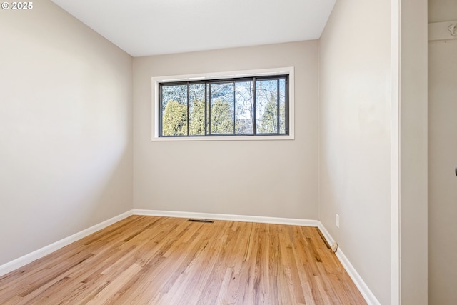 spare room with light hardwood / wood-style floors