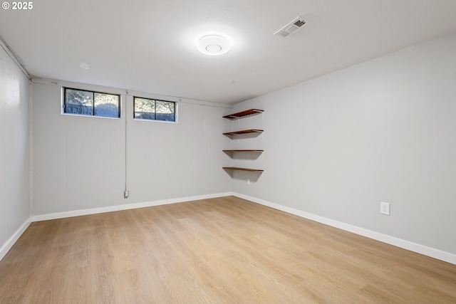 basement featuring light wood-type flooring