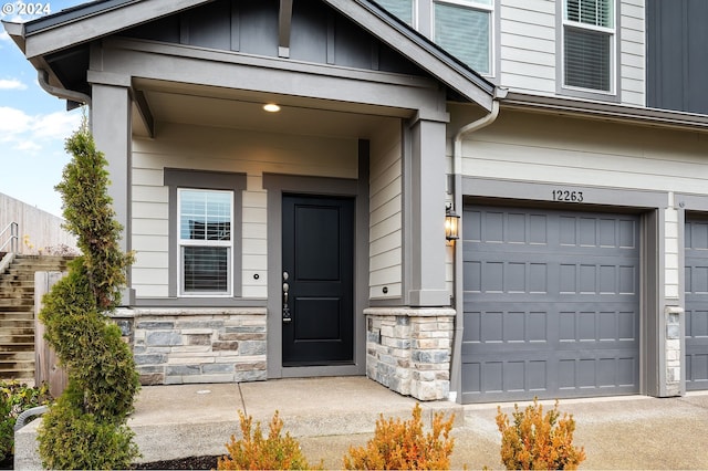 doorway to property featuring a garage