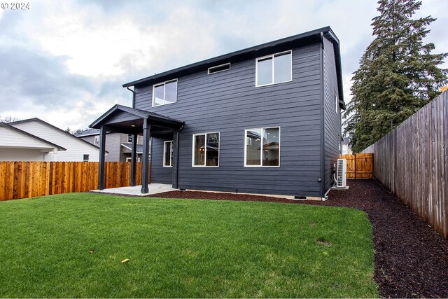 rear view of property with a patio area and a lawn