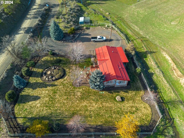 birds eye view of property with a rural view