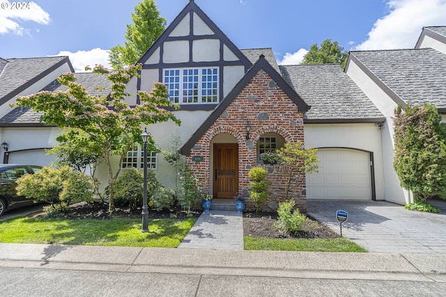 tudor-style house with a garage