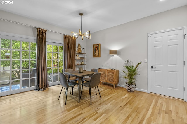 dining room featuring a chandelier and light hardwood / wood-style floors