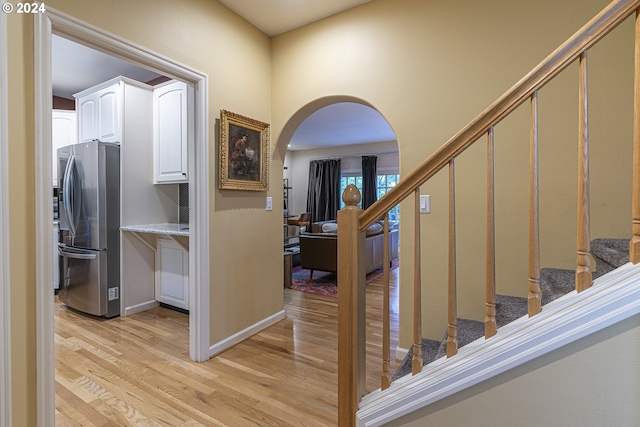 hall with light hardwood / wood-style flooring