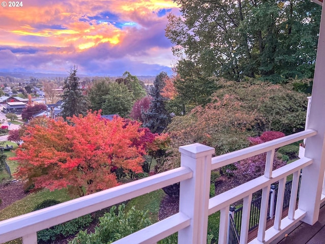 yard at dusk with a balcony