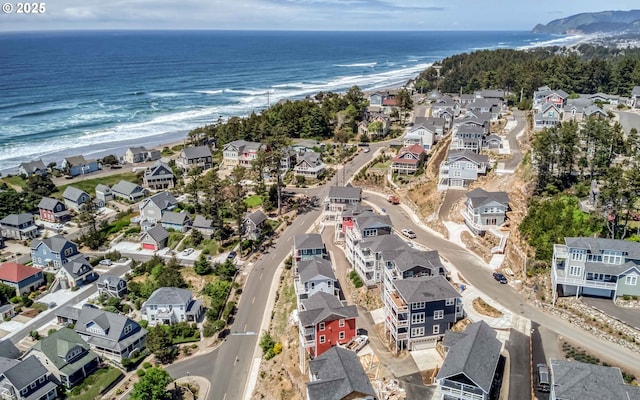 aerial view with a beach view and a water view