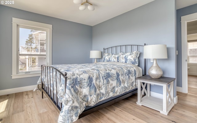 bedroom with light hardwood / wood-style flooring