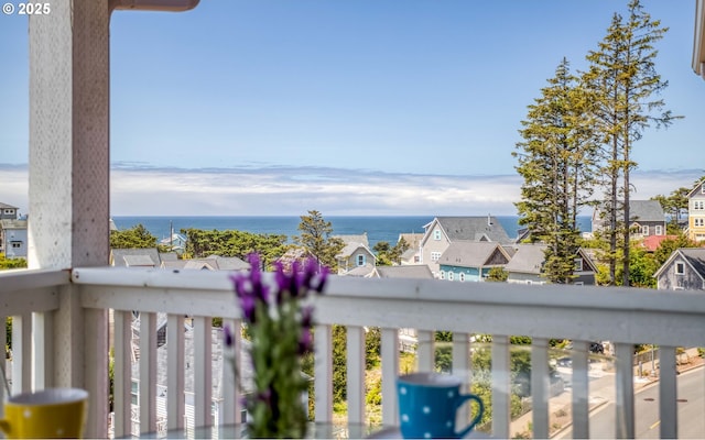 balcony featuring a water view