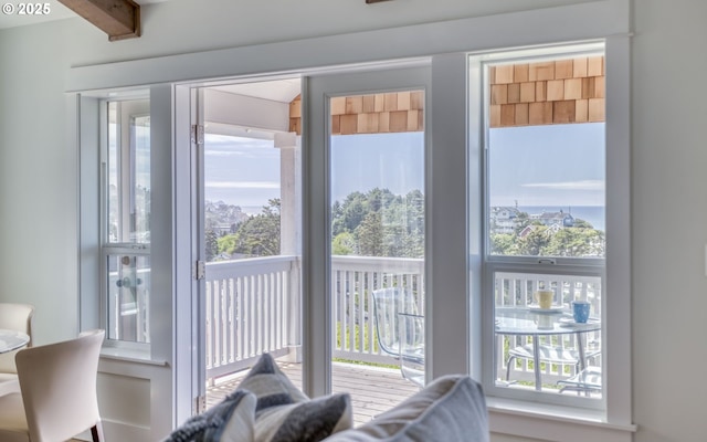 entryway featuring beam ceiling