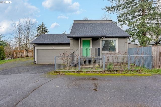 view of front of property with a garage