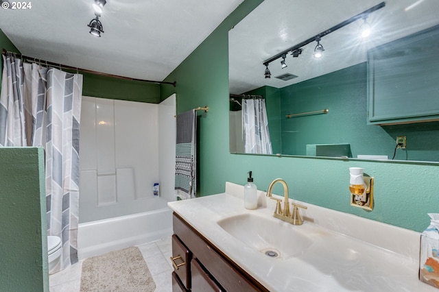 full bathroom featuring tile patterned flooring, track lighting, toilet, shower / bath combo with shower curtain, and vanity