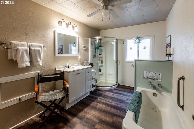 bathroom featuring wood-type flooring, vanity, separate shower and tub, and ceiling fan