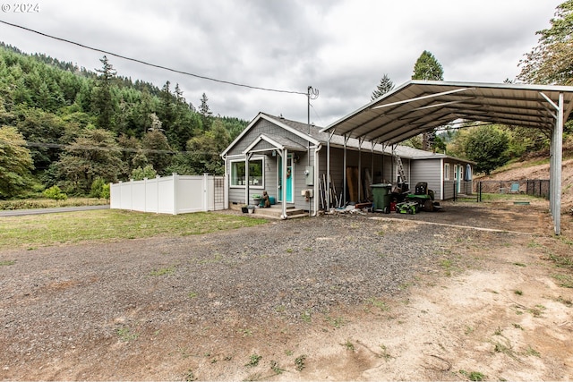 view of front of property with a carport