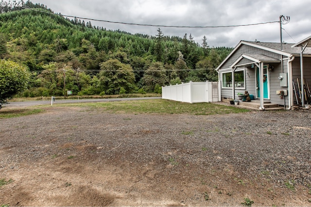 view of yard featuring covered porch