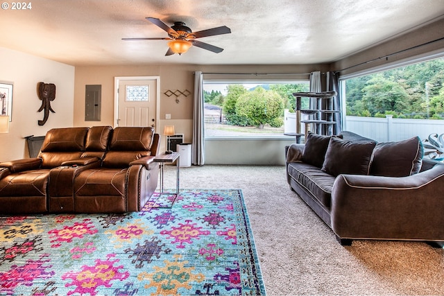 living room featuring a textured ceiling, electric panel, ceiling fan, and light colored carpet