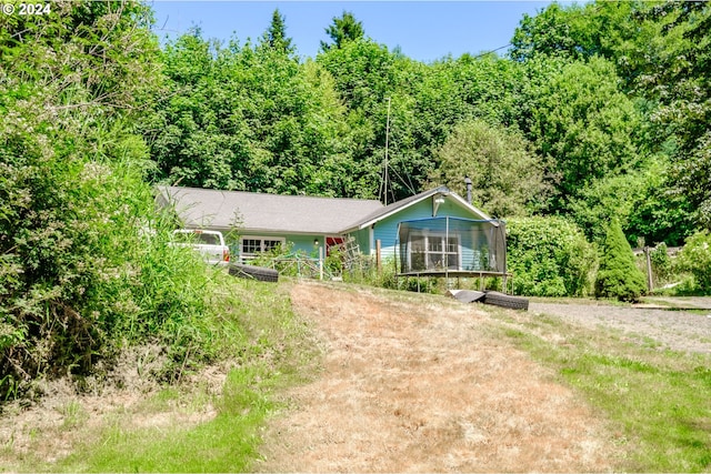 view of front of home featuring a sunroom