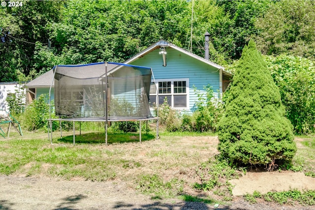 view of front of home with a trampoline