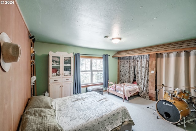 carpeted bedroom with a textured ceiling