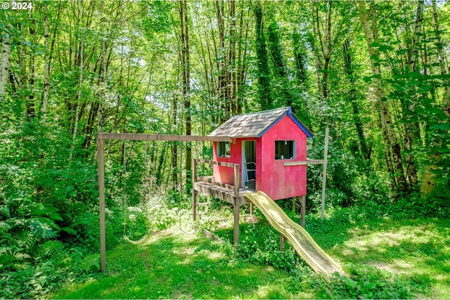 view of play area with an outbuilding