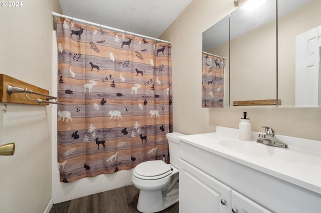 full bathroom featuring vanity, toilet, wood-type flooring, and shower / tub combo