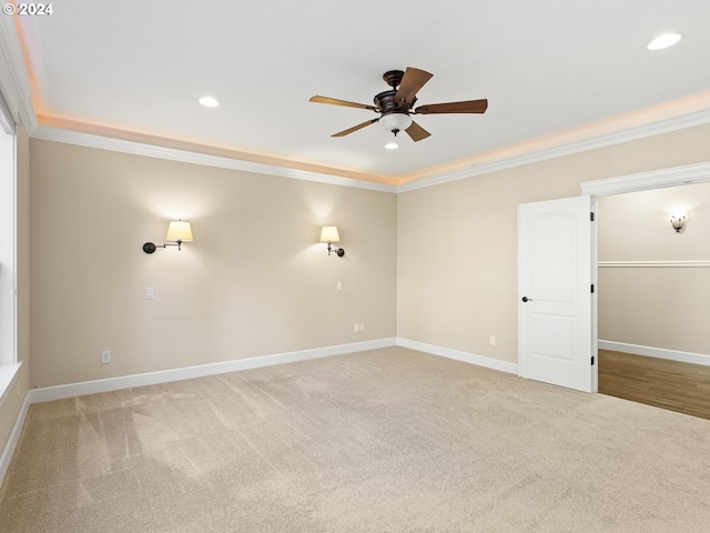 carpeted spare room featuring baseboards, crown molding, and recessed lighting