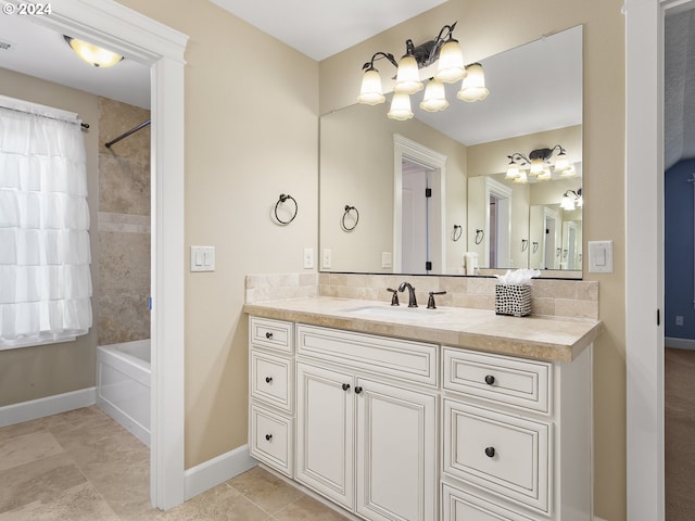 bathroom with shower / washtub combination, vanity, baseboards, and tile patterned floors