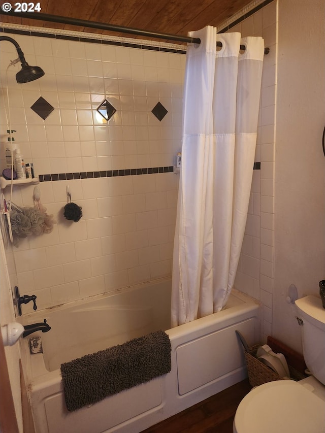 full bath featuring toilet and shower / bathtub combination with curtain