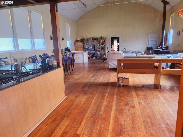 interior space featuring vaulted ceiling and hardwood / wood-style flooring