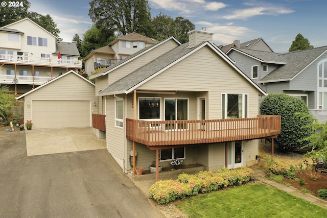 view of front facade featuring an outbuilding and a garage