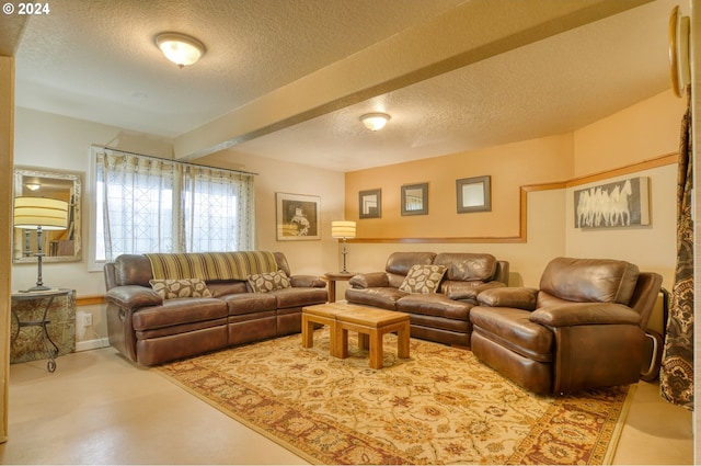 300 Spinnaker Way, Columbia City, OR 97018 - living area featuring a textured ceiling, baseboards, and beamed ceiling