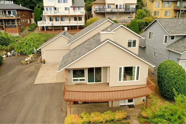 back of house featuring a garage