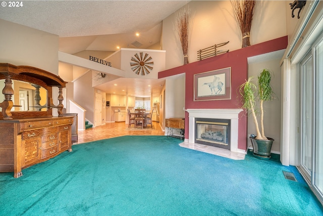 living area with carpet flooring, a textured ceiling, and high vaulted ceiling