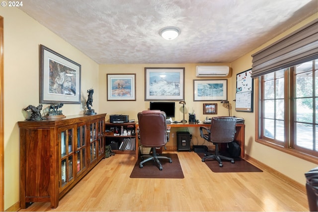 8805 NE 36th St, Vancouver, WA 98662 - office area with baseboards, a wall unit AC, wood finished floors, and a textured ceiling