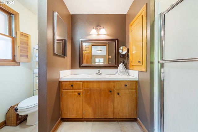 8805 NE 36th St, Vancouver, WA 98662 - full bathroom with vanity, toilet, baseboards, tile patterned floors, and an enclosed shower