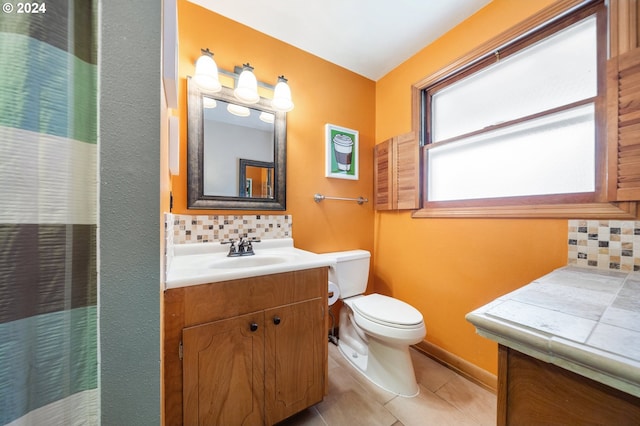 8805 NE 36th St, Vancouver, WA 98662 - bathroom featuring toilet, tile patterned floors, backsplash, and vanity
