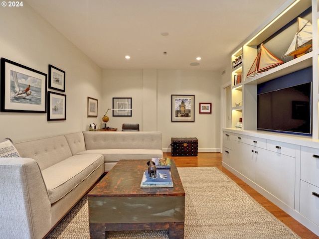 1221 SW 10th Ave Unit 1704, Portland, OR 97205 - living room featuring recessed lighting, wood finished floors, and baseboards